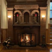 Foyer fireplace with fire burning