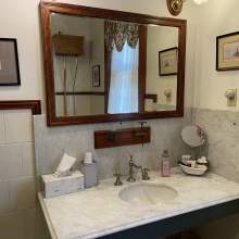 President's Bathroom view of sink with toiletries